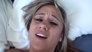 A blonde with a pretty face is getting a hot load of cum in her mouth