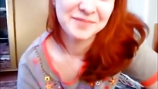 Cute redhead gives a blowjob in the chatroom