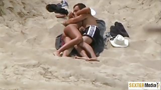 Hot couple caught having sex on the beach